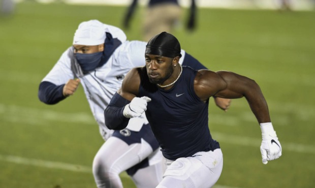Penn State defensive end Jayson Oweh warms up before an NCAA college football game against Ohio Sta...