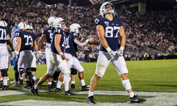 Pat Freiermuth #87 of the Penn State Nittany Lions celebrates after Noah Cain #21 of the Penn State...