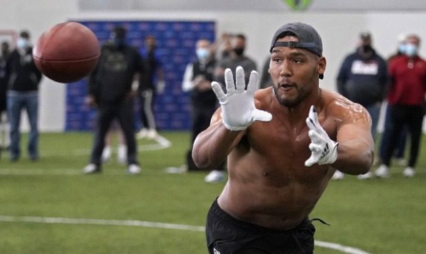 Tulsa linebacker Zaven Collins reaches for a pass during NFL football pro day Friday, April 2, 2021...