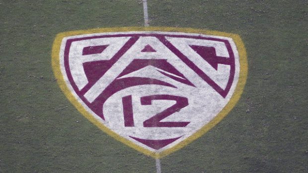 In this Aug. 29, 2019, file photo, the Pac-12 logo is displayed on the field at Sun Devil Stadium d...