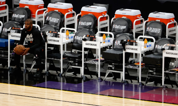 Chris Paul #3 of the Phoenix Suns sits on the bench before Game Two of the Western Conference first...