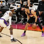 PHOENIX, ARIZONA - MAY 23: Devin Booker #1 of the Phoenix Suns handles the ball against Kentavious Caldwell-Pope #1 of the Los Angeles Lakers during the first half of Game One of the Western Conference first-round playoff series at Phoenix Suns Arena on May 23, 2021 in Phoenix, Arizona. NOTE TO USER: User expressly acknowledges and agrees that, by downloading and or using this photograph, User is consenting to the terms and conditions of the Getty Images License Agreement.  (Photo by Christian Petersen/Getty Images)
