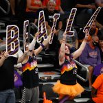 PHOENIX, ARIZONA - MAY 25: Fans of the Phoenix Suns hold up "beat la" signs during the first half of Game Two of the Western Conference first-round playoff series at Phoenix Suns Arena on May 25, 2021 in Phoenix, Arizona. (Photo by Christian Petersen/Getty Images)