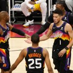 PHOENIX, ARIZONA - MAY 25: Devin Booker #1 of the Phoenix Suns high fives Chris Paul #3 and Mikal Bridges #25 after scoring against the Los Angeles Lakers during the second half of Game Two of the Western Conference first-round playoff series at Phoenix Suns Arena on May 25, 2021 in Phoenix, Arizona. (Photo by Christian Petersen/Getty Images)