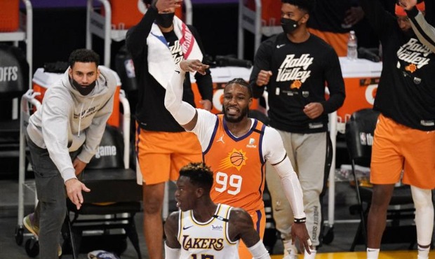 Phoenix Suns forward Jae Crowder (99) appears to taunt Los Angeles Lakers guard Dennis Schroder aft...