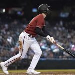 Arizona Diamondbacks' Pavin Smith watches the flight of his two-run home run against the Colorado Rockies during the fifth inning of a baseball game Sunday, May 2, 2021, in Phoenix. (AP Photo/Ross D. Franklin)