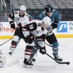 Arizona Coyotes left wing Michael Bunting (58) clears the puck as San Jose Sharks center Alexander Chmelevski (55) tries for possession during the first period of an NHL hockey game in San Jose, Calif., Saturday, May 8, 2021. (AP Photo/John Hefti)