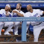 Los Angeles Dodgers' Albert Pujols, right, talks with Justin Turner, left, and Max Muncy in the dugout during a baseball game against the Arizona Diamondbacks Monday, May 17, 2021, in Los Angeles. (AP Photo/Mark J. Terrill)