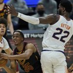 
              Cleveland Cavaliers' Isaac Okoro (35) drives to the basket against Phoenix Suns' Deandre Ayton (22) in the second half of an NBA basketball game, Tuesday, May 4, 2021, in Cleveland. (AP Photo/Tony Dejak)
            