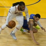 Phoenix Suns forward Jae Crowder, left, grabs the ball in front of Golden State Warriors forward Juan Toscano-Anderson during the first half of an NBA basketball game in San Francisco, Tuesday, May 11, 2021. (AP Photo/Jeff Chiu)