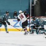 Arizona Coyotes center Christian Dvorak (18) scores a goal against the San Jose Sharks during the first period of an NHL hockey game in San Jose, Calif., Saturday, May 8, 2021. (AP Photo/John Hefti)