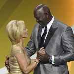 Presenter Michael Jordan, right, congratulates Kim Mulkey after Mulkey, formerly coach at Baylor and now at LSU, was enshrined with the 2020 Basketball Hall of Fame class, Saturday, May 15, 2021, in Uncasville, Conn. (AP Photo/Kathy Willens)