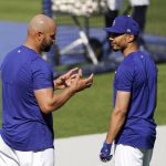 
              Los Angeles Dodgers first baseman Albert Pujols, left, talks with right fielder Mookie Betts prior to a baseball game against the Arizona Diamondbacks Monday, May 17, 2021, in Los Angeles. (AP Photo/Mark J. Terrill)
            