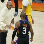Phoenix Suns head coach Monty Williams, left, celebrates with Suns guard Chris Paul (3) after Paul scored against the Los Angeles Lakers during the first half of Game 2 of their NBA basketball first-round playoff series Tuesday, May 25, 2021, in Phoenix. (AP Photo/Ross D. Franklin)