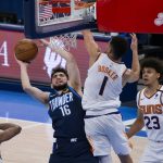 Oklahoma City Thunder guard Ty Jerome (16) shoots against Phoenix Suns guard Devin Booker (1) while guard Jevon Carter (4) and forward Cameron Johnson (23) look on during the second half of an NBA basketball game, Sunday, May 2, 2021, in Oklahoma City. (AP Photo/Garett Fisbeck)