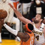 Phoenix Suns forward Torrey Craig, left, shoots as Los Angeles Lakers center Marc Gasol defends during the first half in Game 4 of an NBA basketball first-round playoff series Sunday, May 30, 2021, in Los Angeles. (AP Photo/Mark J. Terrill)