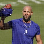 Los Angeles Dodgers first baseman Albert Pujols waves to people in the stands during batting practice prior to a baseball game against the Arizona Diamondbacks Monday, May 17, 2021, in Los Angeles. (AP Photo/Mark J. Terrill)