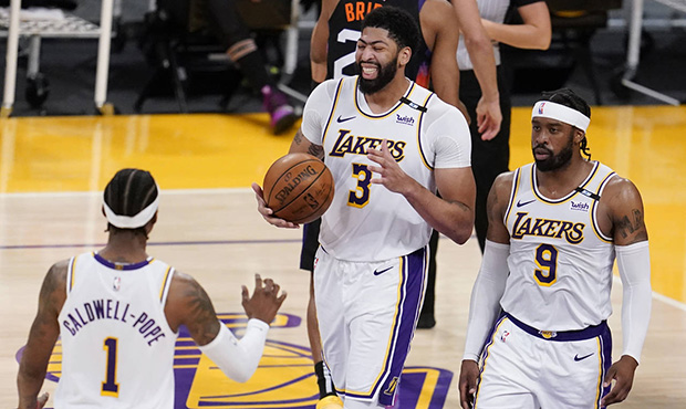 Los Angeles Lakers forward Anthony Davis (3) reacts after scoring next to teammates Kentavious Cald...