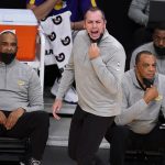 Los Angeles Lakers coach Frank Vogel, center, argues a call during the first half of the team's NBA basketball game against the Phoenix Suns Son unday, May 9, 2021, in Los Angeles. (AP Photo/Marcio Jose Sanchez)