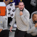 Los Angeles Lakers coach Frank Vogel, center, argues a call during the first half of the team's NBA basketball game against the Phoenix Suns Son unday, May 9, 2021, in Los Angeles. (AP Photo/Marcio Jose Sanchez)