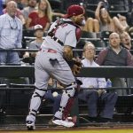 St. Louis Cardinals catcher Yadier Molina drops a foul ball hit by Arizona Diamondbacks' Carson Kelly during the eighth inning of a baseball game Friday, May 28, 2021, in Phoenix. The Cardinals won 8-6. (AP Photo/Ross D. Franklin)