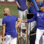 Los Angeles Dodgers first baseman Albert Pujols, left, talks with manager Dave Roberts prior to a baseball game against the Arizona Diamondbacks Monday, May 17, 2021, in Los Angeles. (AP Photo/Mark J. Terrill)