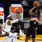 Phoenix Suns guard Chris Paul, right, shoots over Los Angeles Lakers guard Kentavious Caldwell-Pope (1) and guard Wesley Matthews (9) during the first half of an NBA basketball game Sunday, May 9, 2021, in Los Angeles. (AP Photo/Marcio Jose Sanchez)