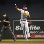St. Louis Cardinals second baseman Matt Carpenter, right, makes the off-balance throws for an out on a ball hit by Arizona Diamondbacks' Josh Rojas (not shown) in the first inning during a baseball game, Sunday, May 30, 2021, in Phoenix. (AP Photo/Rick Scuteri)