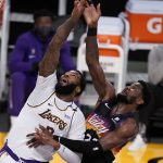 Los Angeles Lakers center Andre Drummond, left, vies for a rebound against Phoenix Suns center Deandre Ayton during the second half of an NBA basketball game Sunday, May 9, 2021, in Los Angeles. (AP Photo/Marcio Jose Sanchez)