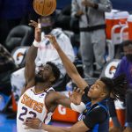 Phoenix Suns center Deandre Ayton (22) goes against Oklahoma City Thunder center Moses Brown (9) during the tipoff of an NBA basketball game, Sunday, May 2, 2021, in Oklahoma City. (AP Photo/Garett Fisbeck)