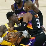 Phoenix Suns guard Chris Paul (3) stops the drive by Los Angeles Lakers guard Dennis Schroder, left, during the first half of Game 2 of their NBA basketball first-round playoff series Tuesday, May 25, 2021, in Phoenix. (AP Photo/Ross D. Franklin)