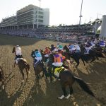 The field of 19 horses and riders bolt out of the starting gate during the 147th running of the Kentucky Derby at Churchill Downs, Saturday, May 1, 2021, in Louisville, Ky. John Velazquez won the Derby riding Medina Spirit. (AP Photo/Brynn Anderson)