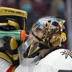 
              Vegas Golden Knights goaltender Marc-Andre Fleury splashes water onto his face during a break in the first period of the team's NHL hockey game against the Arizona Coyotes on Saturday, May 1, 2021, in Glendale, Ariz. (AP Photo/Ross D. Franklin)
            