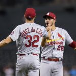 St. Louis Cardinals relief pitcher Daniel Ponce de Leon (32) and third baseman Nolan Arenado (28) celebrate after the team's baseball game against the Arizona Diamondbacks on Friday, May 28, 2021, in Phoenix. The Cardinals won 8-6. (AP Photo/Ross D. Franklin)