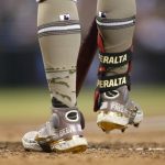 Arizona Diamondbacks' David Peralta honors military members with his cleats as he prepares to bat against the Washington Nationals during the fourth inning of a baseball game Friday, May 14, 2021, in Phoenix. (AP Photo/Darryl Webb)