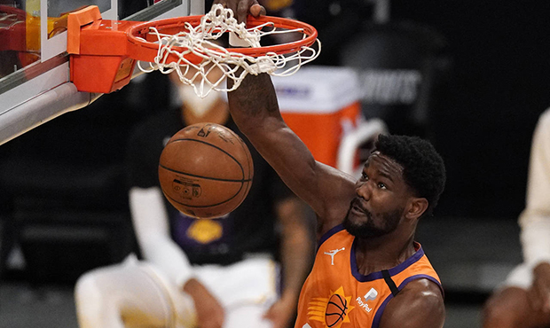 Phoenix Suns center Deandre Ayton dunks during the first half in Game 4 of an NBA basketball first-...