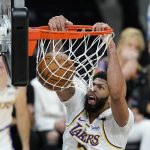 Los Angeles Lakers forward Anthony Davis dunks against the Phoenix Suns during the first half of Game 1 of their NBA basketball first-round playoff series Sunday, May 23, 2021, in Phoenix. (AP Photo/Ross D. Franklin)