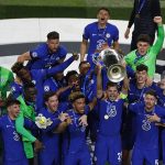 Chelsea players celebrate with the trophy after winning the Champions League final soccer match against Manchester City at the Dragao Stadium in Porto, Portugal, Saturday, May 29, 2021. (Susana Vera/Pool via AP)