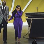 Presenter Michael Jordan, left, escorts Vanessa Bryant off the stage after Bryant's late husband, Kobe Bryant, was enshrined as part of the 2020 Basketball Hall of Fame class Saturday, May 15, 2021 in Uncasville, Conn. (AP Photo/Kathy Willens)