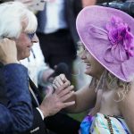Trainer Bob Baffert is greeted by his wife Jill after winning the 147th running of the Kentucky Derby with Medina Spirit at Churchill Downs, Saturday, May 1, 2021, in Louisville, Ky. (AP Photo/Jeff Roberson)