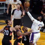 Los Angeles Lakers center Andre Drummond (2) grabs a rebound against the Phoenix Suns during the first half of an NBA basketball game Sunday, May 9, 2021, in Los Angeles. (AP Photo/Marcio Jose Sanchez)