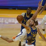 
              Golden State Warriors guard Stephen Curry (30) shoots against Phoenix Suns guard Devin Booker during the second half of an NBA basketball game in San Francisco, Tuesday, May 11, 2021. (AP Photo/Jeff Chiu)
            