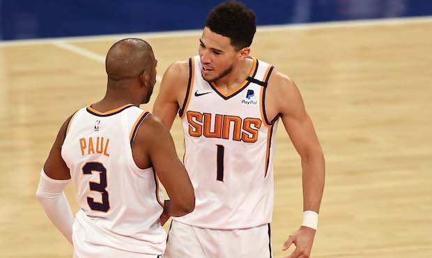 Phoenix Suns guards Chris Paul (#3) and Devin Booker (#1). (Photo by Elsa/Getty Images)...