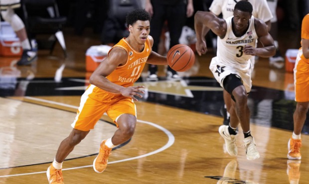 Tennessee's Jaden Springer (11) brings the ball down the court in the second half of an NCAA colleg...