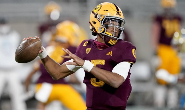 Arizona State quarterback Jayden Daniels (5) looks for a receiver during the first half of the team...