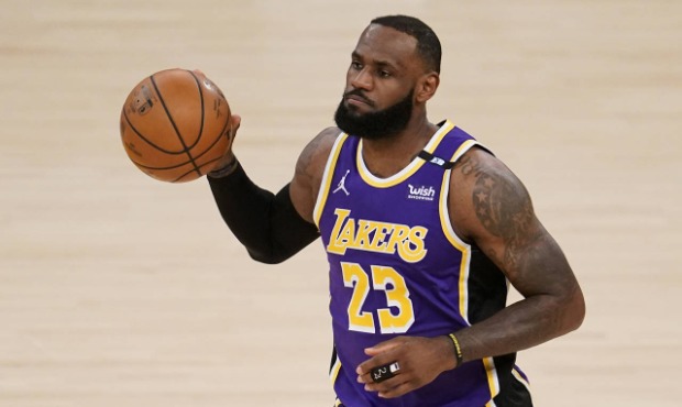 Los Angeles Lakers' LeBron James dribble the ball during the first half of the team's NBA basketbal...