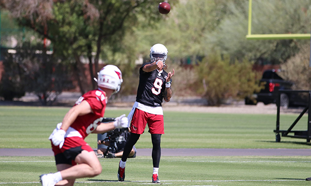 Arizona Cardinals quarterback Cole McDonald throws to tight end Bruno Labelle during rookie minicam...