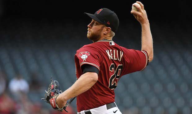 Merrill Kelly #29 of the Arizona Diamondbacks delivers a first inning pitch against the San Francis...