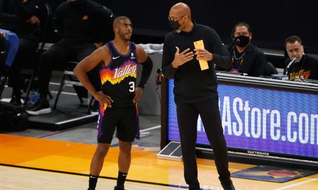 Head coach Monty Williams of the Phoenix Suns talks with Chris Paul #3 of the Phoenix Suns during t...