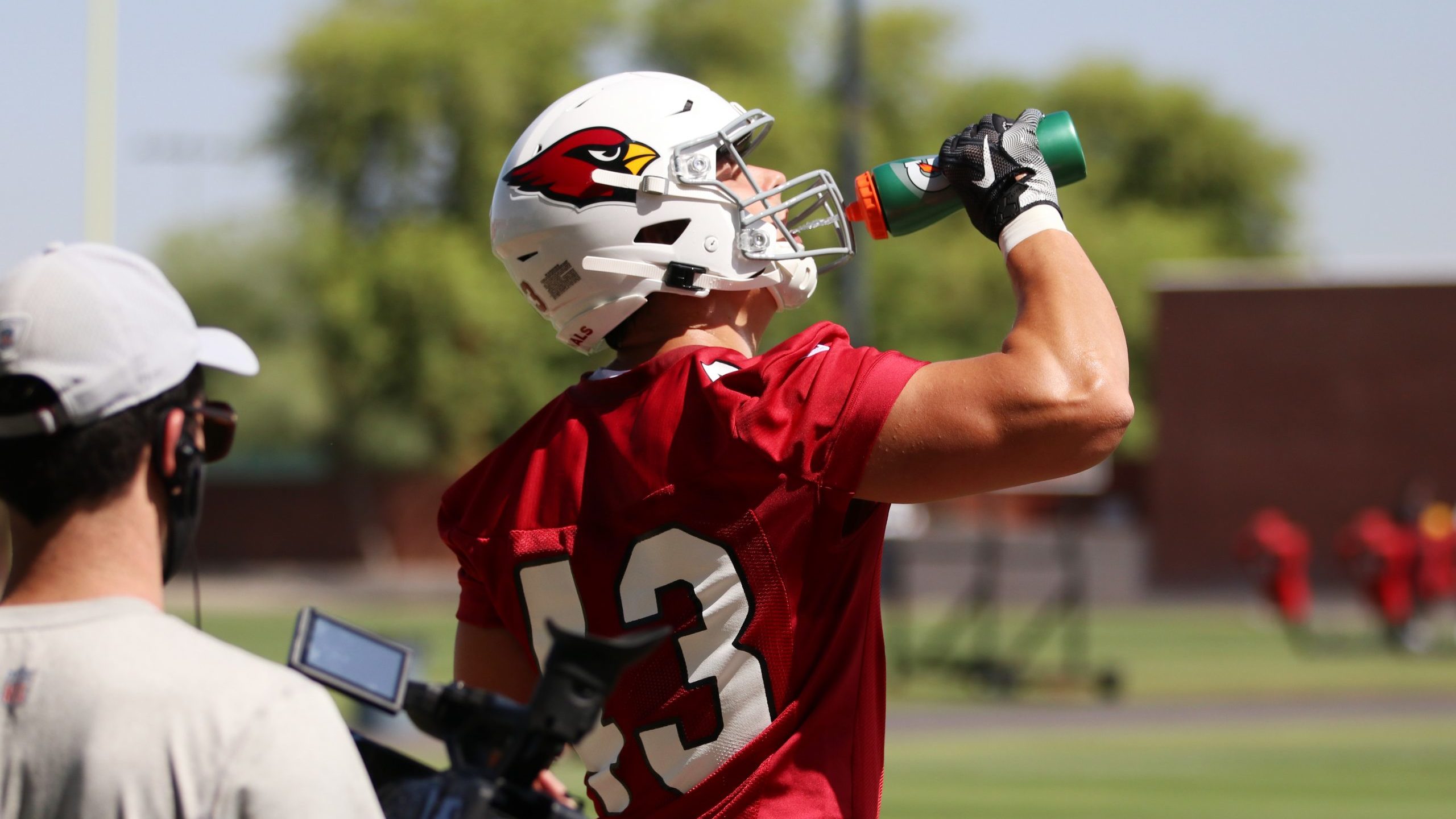 Arizona Cardinals tight end Bernhard Seikovits grabs a drink of water during rookie minicamp Friday...